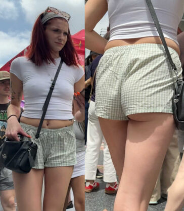Sexy braless redhead girl in shorts