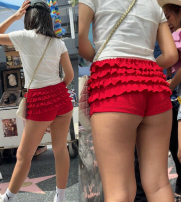 Asian brunette in red shorts